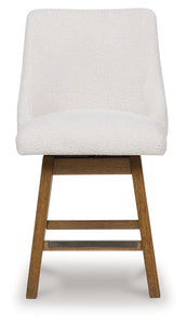 Cabalynn - Oatmeal / Light Brown - Upholstered Swivel Barstool (Set of 2)